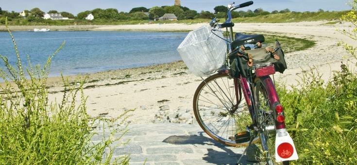Bike on beach in Guernsey